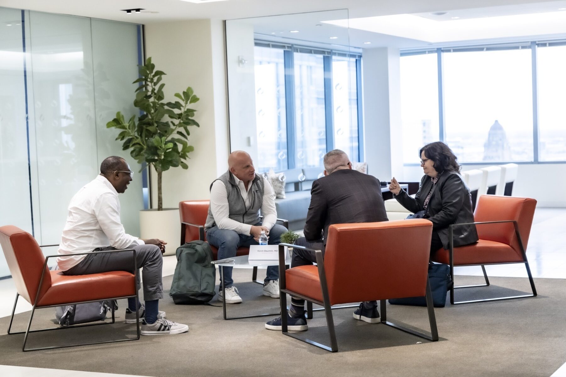 Four participants in a small-group discussion during The Science Center's Capital Readiness program, April 2025.