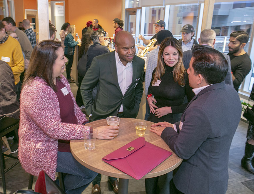 People networking at a business center event.